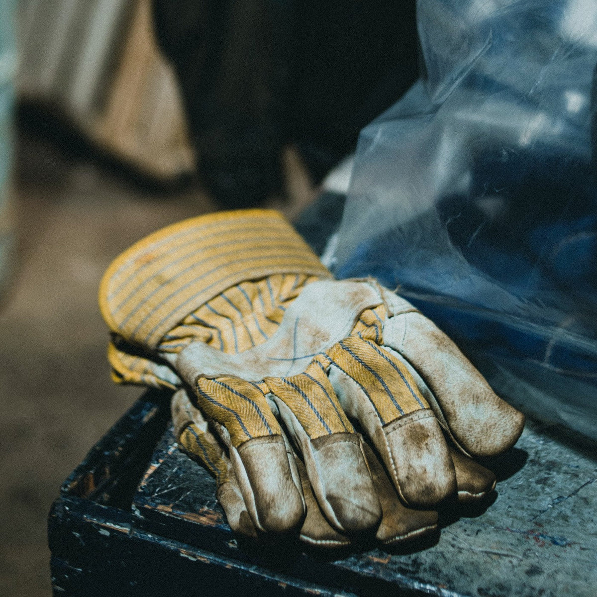 Worn work gloves after a shop day